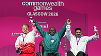 India At Commonwealth Games 2026 Medal Tally: Where Does IND Stand After Day 2? (AP Photo/Eranga Jayawardena) : Winners of the men's heavy weight para powerlifting gold medalist Nigeria's Riluwan Idris, center, silver medalist England's Mathew Harding, left, and bronze medalist India's Jhandu Kumar celebrate during the Commonwealth Games in Glasgow, Scotland, Friday, July 24, 2026.