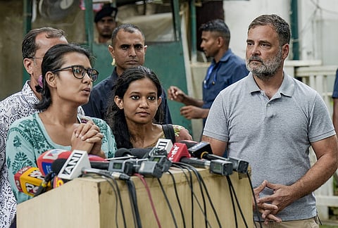 LoP in Lok Sabha and Congress MP Rahul Gandhi looks on as All India Students' Association (AISA) national president Neha Bora addresses a press conference amid the ongoing protest over the NEET paper leak issue, in New Delhi.