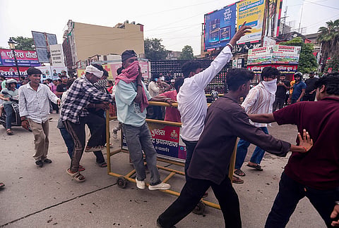 People raise slogans during a protest demanding the resignation of Union Education Minister Dharmendra Pradhan over alleged irregularities in the NEET examination, in Prayagraj, Uttar Pradesh.