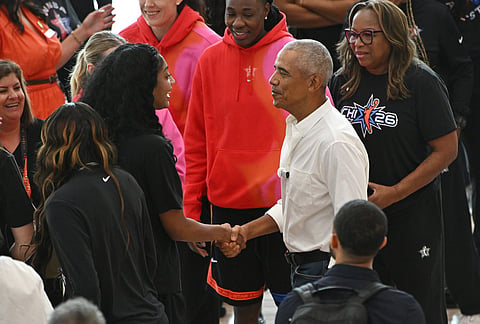 Former President Barack Obama greets WNBA All-Star Angel Reese, left, during a practice at the Obama Presidential Center in Chicago, Friday, July 24, 2026. 