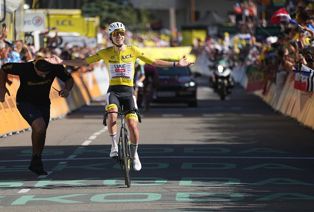 Slovenia's Tadej Pogacar, wearing the overall leader's yellow jersey, crosses the finish line to win the nineteenth stage of the Tour de France cycling race with start in Gap and finish in Alpe d'Huez, France, Friday, July 24, 2026.  - | Photo: AP/Thibault Camus
