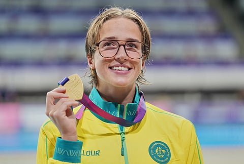 Jenna Forrester of Australia, left, poses for the media with her gold medal for winning the women's 200 meter backstroke swimming event at the Commonwealth Games in Glasgow, Scotland, Friday, July 24, 2026.