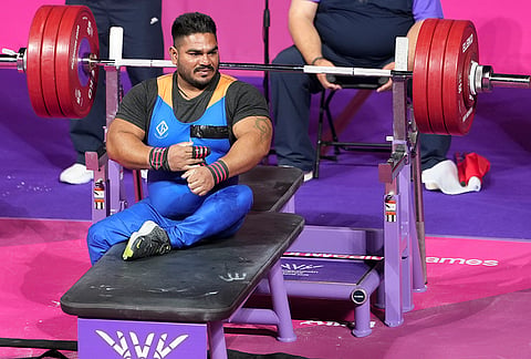 India's Jhandu Kumar competes in the men's heavyweight Group B para powerlifting event at the Commonwealth Games 2026, in Glasgow.
