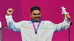 India's Jhandu Kumar celebrates his bronze medal won in the men's heavy weight para power lifting during the Commonwealth Games in Glasgow, Scotland, Friday, July 24, 2026. - (AP Photo/Eranga Jayawardena)