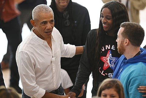 Former President Barack Obama, left, jokes around with WNBA All-Star Jackie Young, right, during a practice at the Obama Presidential Center in Chicago, Friday, July 24, 2026. 