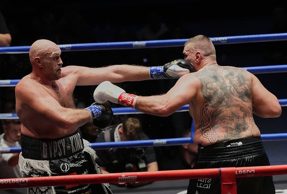 Tyson Fury, of England, left, and Mariusz Wach of Poland, battle during a heavyweight charity bout at Max Muay Thai Stadium in Pattaya, Thailand, Friday, July 24, 2026. 