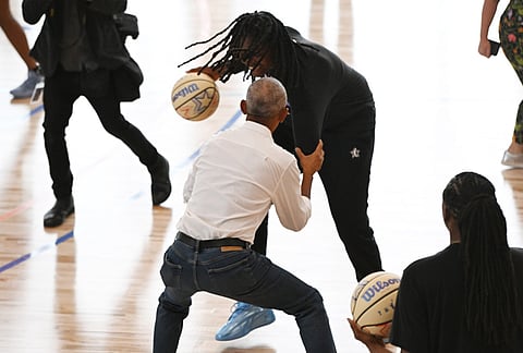 Former President Barack Obama briefly guards WNBA All-Star Jonquil Jones during a practice at the Obama Presidential Center in Chicago, Friday, July 24, 2026.