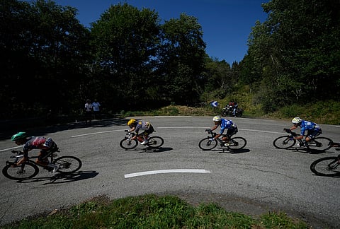 The breakaway with Quinn Simmons of the U.S., center, rides during the nineteenth stage of the Tour de France cycling race with start in Gap and finish in Alpe d'Huez, France, Friday, July 24, 2026. 