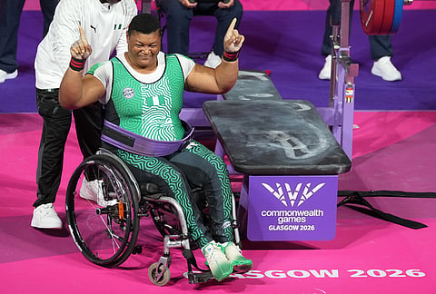 Nigeria's Folashade Oluwafemiayo celebrates after her new record lift in the women's heavy weight para powerlifting during the Commonwealth Games in Glasgow, Scotland, Friday, July 24, 2026. 