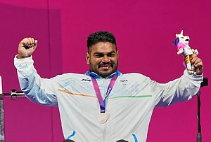 | Photo: AP/Eranga Jayawardena : India's Jhandu Kumar celebrates his bronze medal won in the men's heavy weight para power lifting during the Commonwealth Games in Glasgow, Scotland, Friday, July 24, 2026.