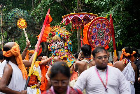 Devotees of International Society of Krishna Consciousness (ISKCON) carry the idol of Balaram during the return of chariots carrying Hindu deities Lord Jagannath, Subhadra and Balaram, which marks the end of the nine-day long chariot festival, in Kolkata.