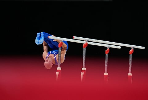 Scotland's Hamish Carter competes at the Parallel bars during men's team final and individual qualification of Artistic Gymnastics at the Commonwealth Games in Glasgow, Scotland, Friday, July 24, 2026.