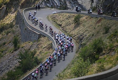 The pack rides during the nineteenth stage of the Tour de France cycling race with start in Gap and finish in Alpe d'Huez, France, Friday, July 24, 2026.