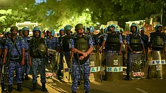 Security personnel stand guard during a protest organised by the Cockroach Janata Party (CJP) at the Jantar Mantar, in New Delhi. - | Photo: PTI/Karma Bhutia