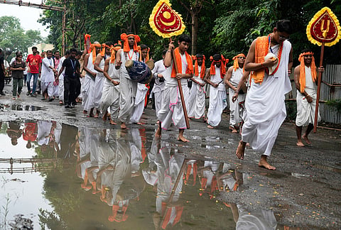 Devotees of International Society of Krishna Consciousness (ISKCON) walk in a procession beside a pool of water during the return of chariots carrying Hindu deities Lord Jagannath, Subhadra and Balaram, which marks the end of the nine-day long chariot festival, in Kolkata, India, Friday, July 24, 2026. 