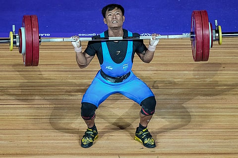 India's Rishikanta Singh competes in the men's 60kg weightlifting competition during the 23rd Commonwealth Games, in Glasgow, Scotland.