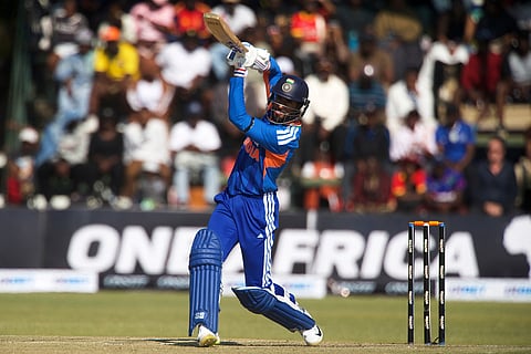 India's batsman Tilak Varma watches his shot during the second T20 cricket match between Zimbabwe and India in Harare, Zimbabwe.