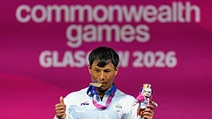 India's Rishikant Chanambam Singh celebrates after wining silver medal in 60 kilogram clean and jerk weightlifting during the Commonwealth Games in Glasgow, Scotland, Sunday, July 26, 2026. - (AP Photo/Manish Swarup)