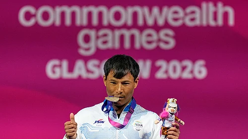 (AP Photo/Manish Swarup) : Indias Rishikant Chanambam Singh celebrates after wining silver medal in 60 kilogram clean and jerk weightlifting during the Commonwealth Games in Glasgow, Scotland, Sunday, July 26, 2026.