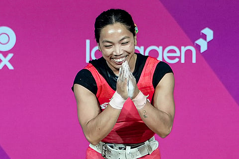 India's Mirabai Chanu celebrates after winning gold medal in the women's 48kg Final weightlifting competition at the 23rd Commonwealth Games, in Glasgow, Scotland.