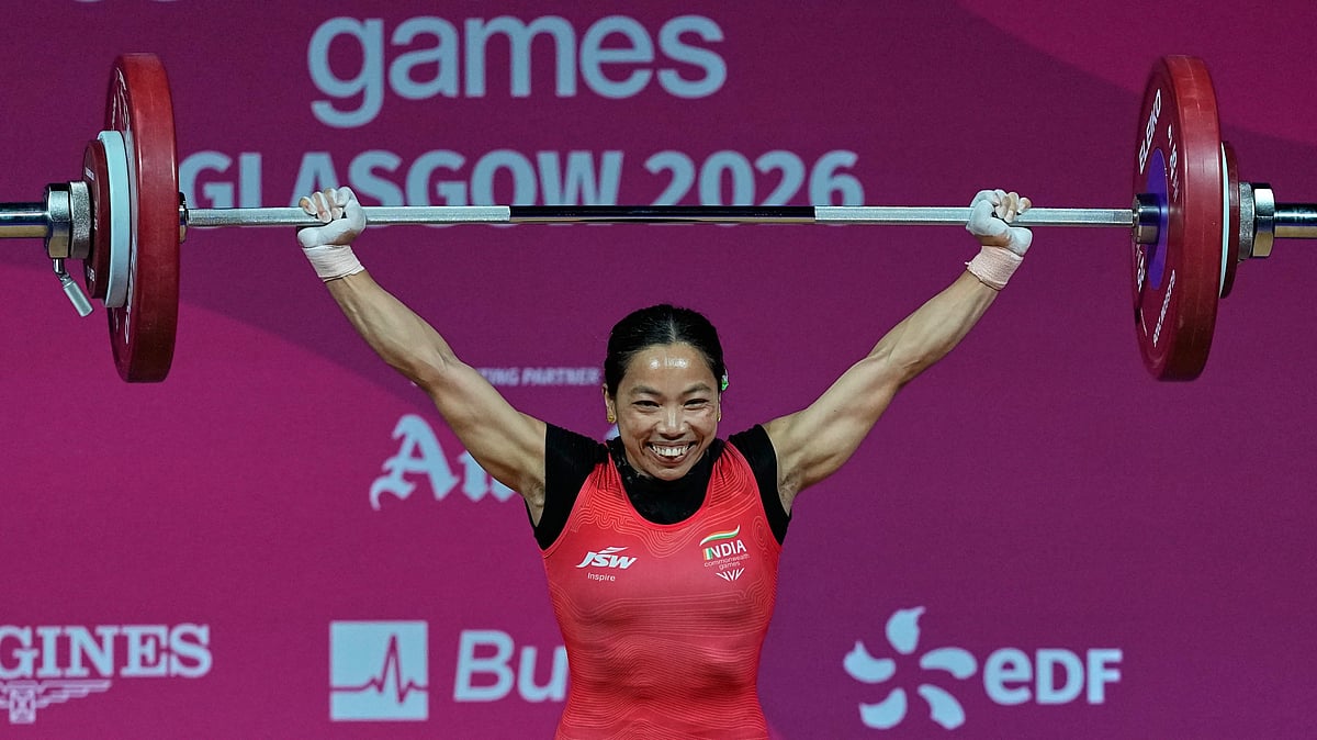 (AP Photo/Manish Swarup) : Indias Mirabai Chanu celebrates after a successful lift in the womens 48 kilogram weightlifting during the Commonwealth Games in Glasgow, Scotland, Sunday, July 26, 2026. 