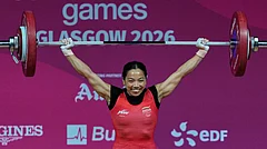 India's Mirabai Chanu celebrates after a successful lift in the women's 48 kilogram weightlifting during the Commonwealth Games in Glasgow, Scotland, Sunday, July 26, 2026. - (AP Photo/Manish Swarup)
