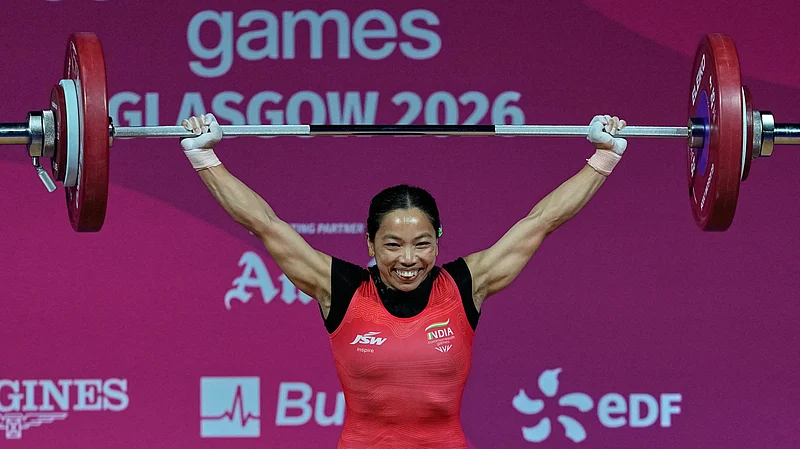(AP Photo/Manish Swarup) : Indias Mirabai Chanu celebrates after a successful lift in the womens 48 kilogram weightlifting during the Commonwealth Games in Glasgow, Scotland, Sunday, July 26, 2026.
