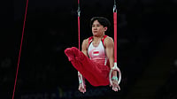 (AP Photo/Manish Swarup) : Singapore's Jovi Loh competes at the Rings during the men's team final and individual qualification of Artistic Gymnastics at the Commonwealth Games in Glasgow, Scotland, Friday, July 24, 2026.
