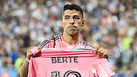 (Graham Hughes/The Canadian Press via AP) : Inter Miami's Luis Suarez holds up the jersey of teammate German Berterame after scoring a penalty kick against CF Montreal during theur MLS match in Montreal on Saturday, July 25, 2026.