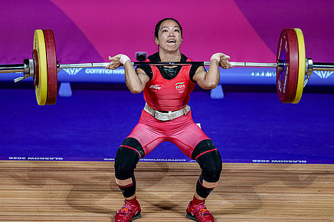 India's Mirabai Chanu competes in the women's 48kg Final weightlifting competition at the 23rd Commonwealth Games, in Glasgow, Scotland.