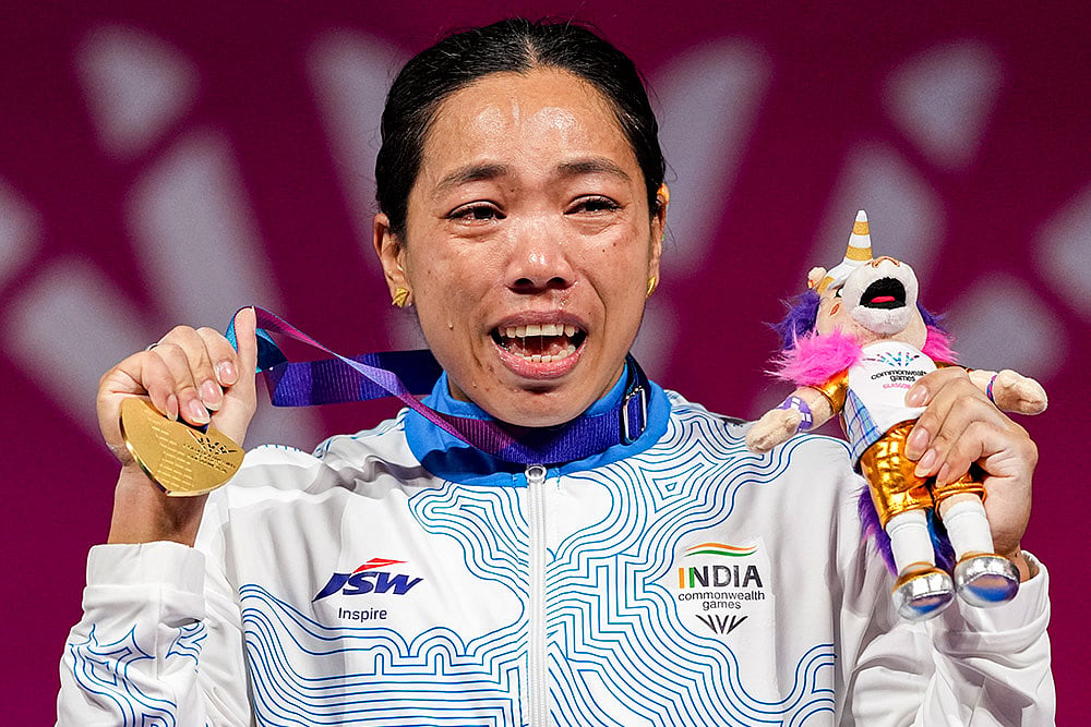 India's Mirabai Chanu wins gold medal in the women's 48kg Final weightlifting competition at the 23rd Commonwealth Games, in Glasgow, Scotland, Sunday, July 26, 2026. She clinched her third successive Commonwealth Games gold medal in the women’s 48kg category. - | Photo: PTI/Ravi Choudhary