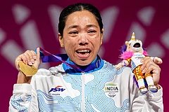 India's Mirabai Chanu wins gold medal in the women's 48kg Final weightlifting competition at the 23rd Commonwealth Games, in Glasgow, Scotland, Sunday, July 26, 2026. She clinched her third successive Commonwealth Games gold medal in the women’s 48kg category. - | Photo: PTI/Ravi Choudhary