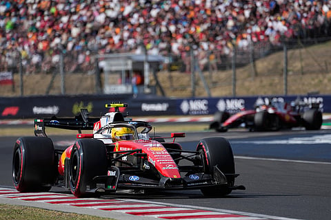 Ferrari driver Lewis Hamilton of Britain steers his car during a qualifying session ahead of Sunday's Formula One Hungarian Grand Prix auto race, at the Hungaroring racetrack in Mogyorod, near Budapest, Hungary.