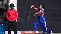 IND Vs ZIM Live Score, 3rd T20I: Ravi Bishnoi Removes Ben Curran As Zimbabwe Lose Another Wicket | Photo: AP/Wonder Mashura : India's bowler Ravi Bishnoi, right, prepares to bowl as umpire Iknow Chabi of Zimbabwe, looks on during the first T20 cricket match between Zimbabwe and India in Harare, Zimbabwe, Thursday, July 23, 2026.