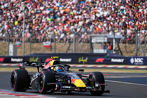 Red Bull driver Isack Hadjar of France steers his car during a qualifying session ahead of Sunday's Formula One Hungarian Grand Prix auto race, at the Hungaroring racetrack in Mogyorod, near Budapest, Hungary.