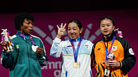 (AP Photo/Manish Swarup) : From left, silver medalist Nigeria's Ruth Asuquo Nyong, gold medalist India's Mirabai Chanu and bronze medalist Malaysia's Irene Jane Henry celebrate on the podium for the women's 48 kilogram weightlifting, during the Commonwealth Games in Glasgow, Scotland, Sunday, July 26, 2026.
