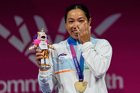 India's Mirabai Chanu celebrates after winning the gold medal in the women's 48 kilogram weightlifting during the Commonwealth Games in Glasgow, Scotland, Sunday, July 26, 2026.