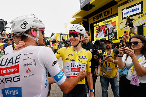 Slovenia's Tadej Pogacar, right, and Mexico's Isaac Del Toro, left, celebrate after the twentieth stage of the Tour de France cycling race with start in Le Bourg d'Oisans and finish in Alpe d'Huez, France.