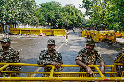 Security personnel keep a vigil near the protest site of Jantar Mantar, in New Delhi.The Cockroach Janata Party (CJP) on Saturday called off its 36-day agitation after Education Minister Dharmendra Pradhan resigned and the government accepted its other demands.