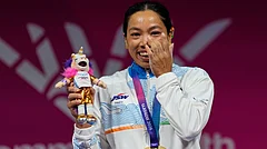India's Mirabai Chanu celebrates after winning the gold medal in the women's 48 kilogram weightlifting during the Commonwealth Games in Glasgow, Scotland, Sunday, July 26, 2026. - (AP Photo/Manish Swarup)