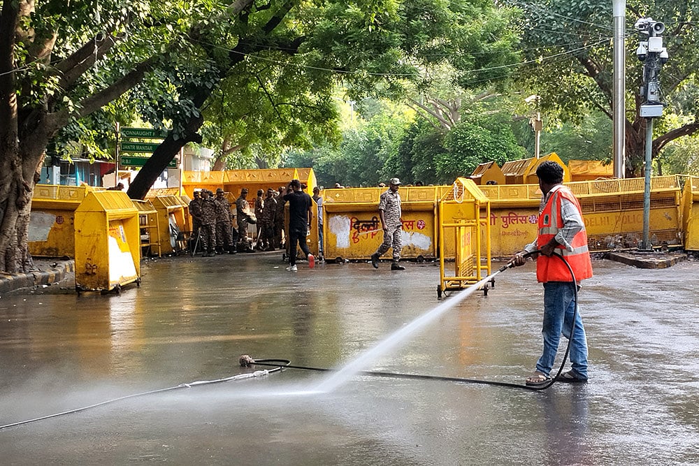 Workers clean Jantar Mantar