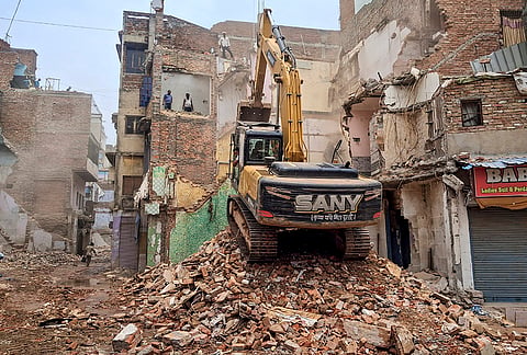 Authorities conduct a demolition drive as part of the Dalmandi road widening project, in Varanasi.

