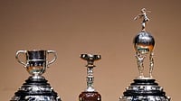 | Photo: PTI/Shahbaz Khan : Trophies for the commencement of 'Trophy Tour' of the 'Durand Cup' tournament 2026 displayed at Rashtrapati Bhavan Cultural Center (RBCC), in New Delhi.