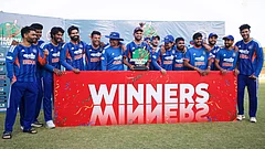 India's captain Shreyas Iyer, center, holds a trophy as he celebrate with teammates following the third T20 cricket match against Zimbabwe in Harare, Zimbabwe. - | Photo: AP/Wonder Mashura
