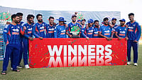 Shreyas Iyer Praises VVS Laxman For His Mentorship After Zimbabwe Triumph | Photo: AP/Wonder Mashura : India's captain Shreyas Iyer, center, holds a trophy as he celebrate with teammates following the third T20 cricket match against Zimbabwe in Harare, Zimbabwe.