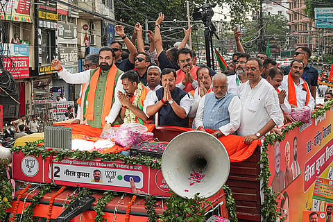 Bihar Chief Minister Samrat Choudhary, BJP National President Nitin Nabin and others during a roadshow in support of the party candidate Neeraj Kumar Sinha ahead of the Bankipur Assembly by-poll, in Patna.