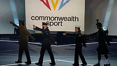 The flag of Commonwealth Sport is raised as the military flag carriers march off during the Commonwealth Games opening ceremony in Glasgow, Scotland. - | Photo: AP/Manish Swarup