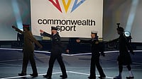 Sharmila Dhankar And Shilpa K Shyla LIVE Score Commonwealth Games: Indians Yet To Throw | Photo: AP/Manish Swarup : The flag of Commonwealth Sport is raised as the military flag carriers march off during the Commonwealth Games opening ceremony in Glasgow, Scotland.