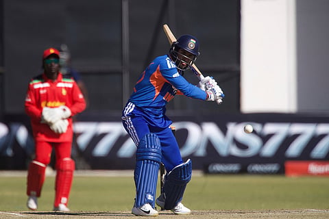 India's batsman Tilak Varma, right, plays a short as Zimbabwe's wicketkeeper Tadiwanashe Marumani looks on during the third T20 cricket match between Zimbabwe and India in Harare, Zimbabwe.