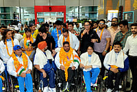 Day In Pics: July 27, 2026 | Photo: PTI : Commonwealth Games 2026 bronze medallist and para powerlifter Jhandu Kumar, front centre, arrives at Indira Gandhi International Airport, in New Delhi.